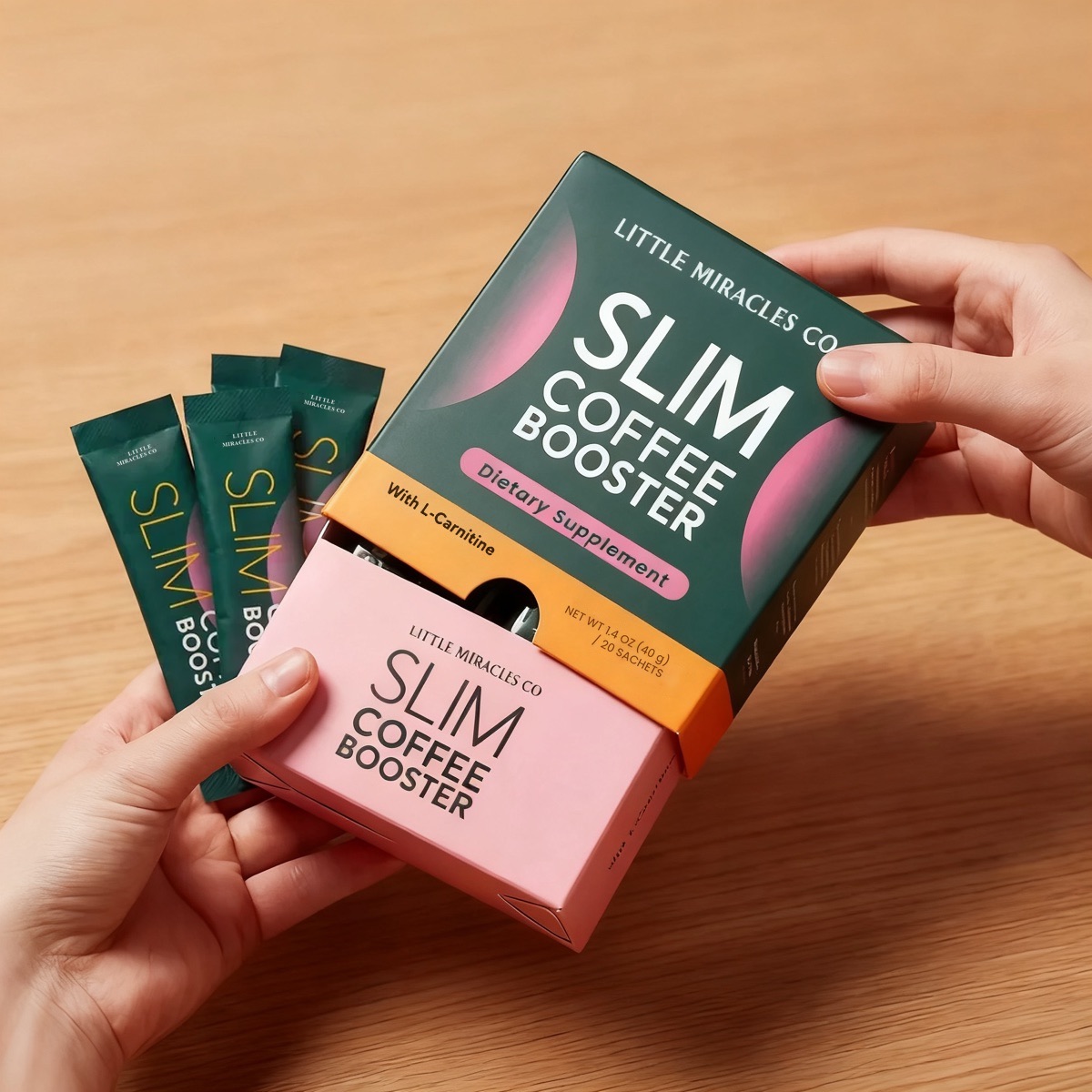 Opening the Slim Coffee Booster box, sachets beside it